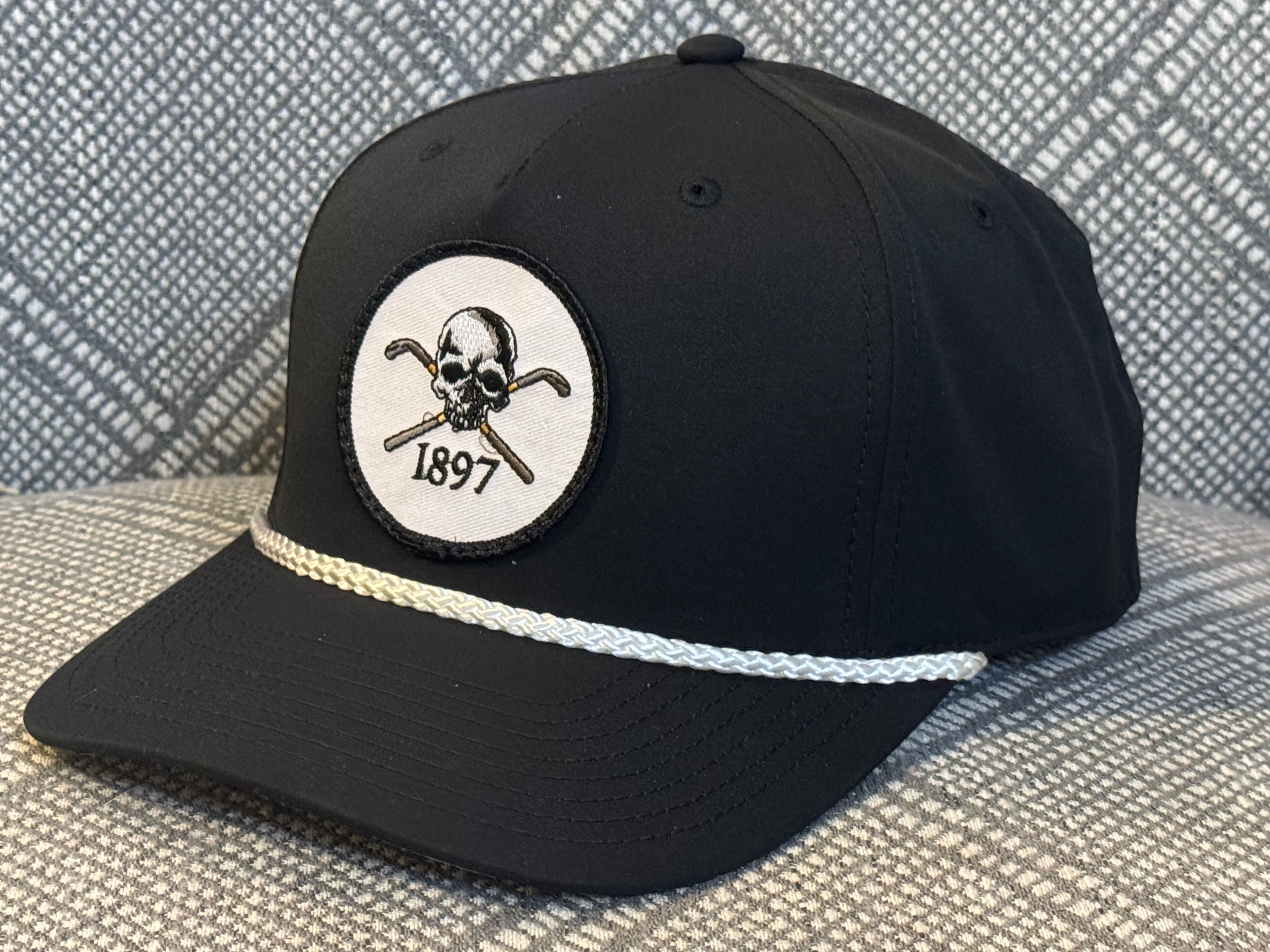 The BANNED Logo on Low to Mid Profile Black Hat with White Rope